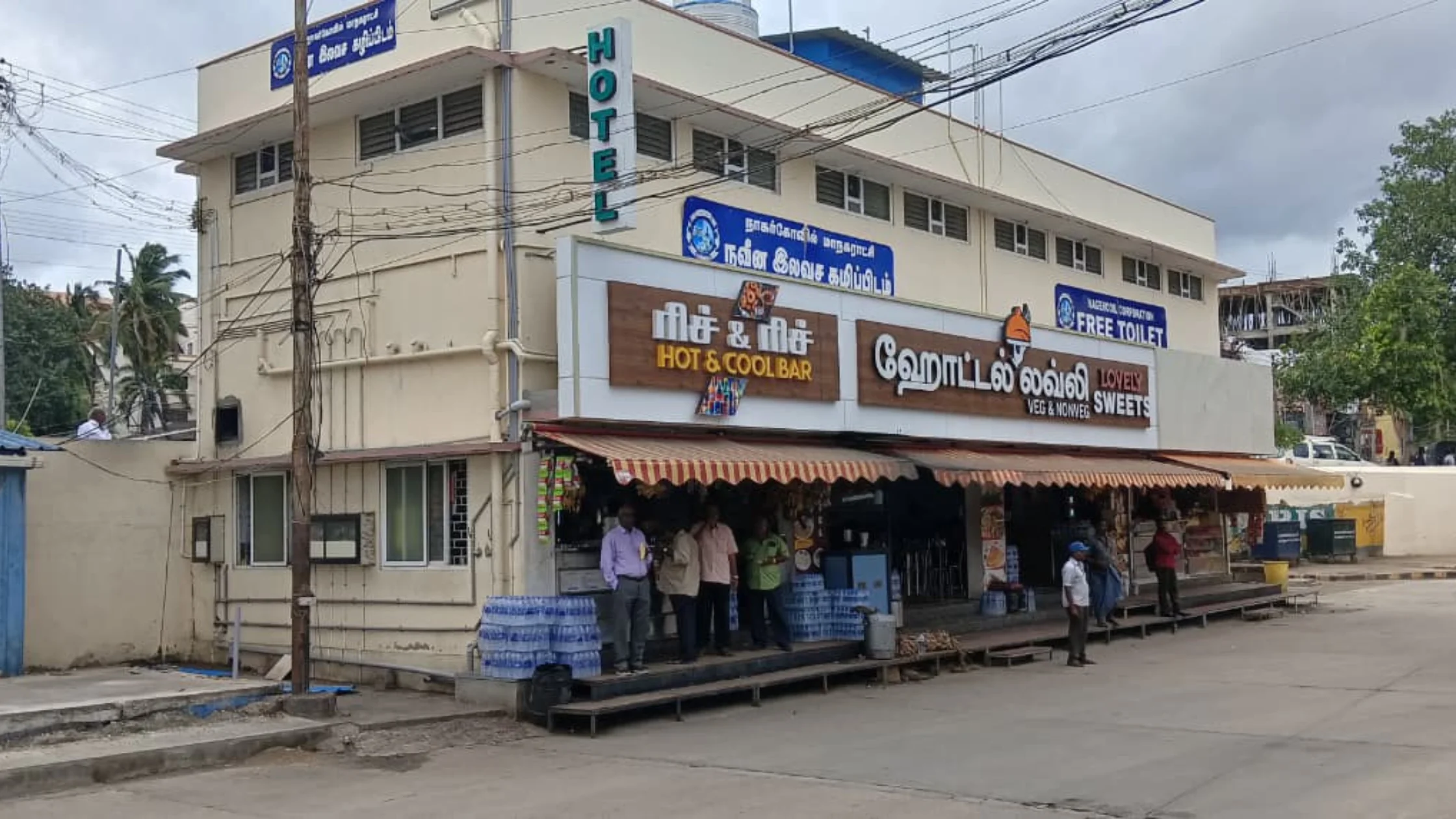 Free public toilet in Nagercoil with restaurants operating underneath, facing civic opposition.